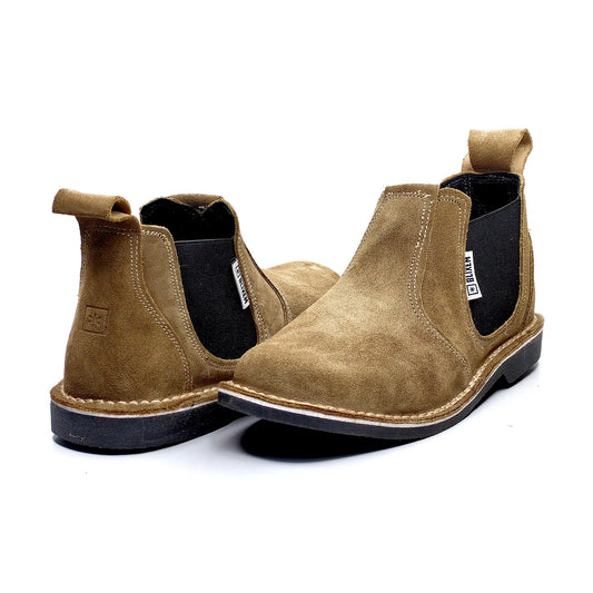 Pair of brown suede Chelsea boots on a white background