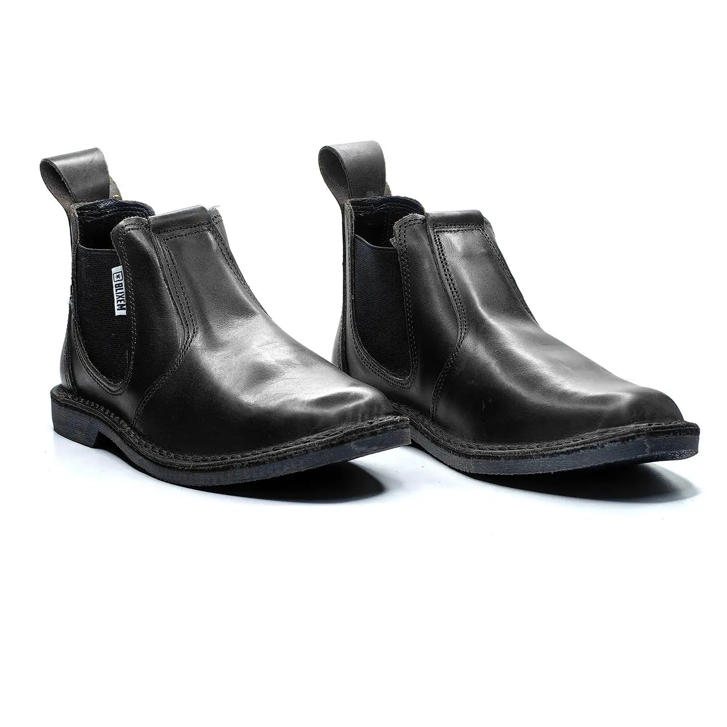 Pair of black leather Chelsea boots on a white background