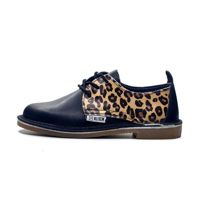 Black shoe with leopard print side panel on a white background