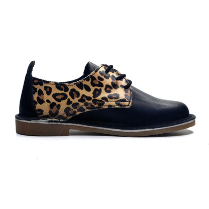 Black shoe with leopard print side panel on a white background