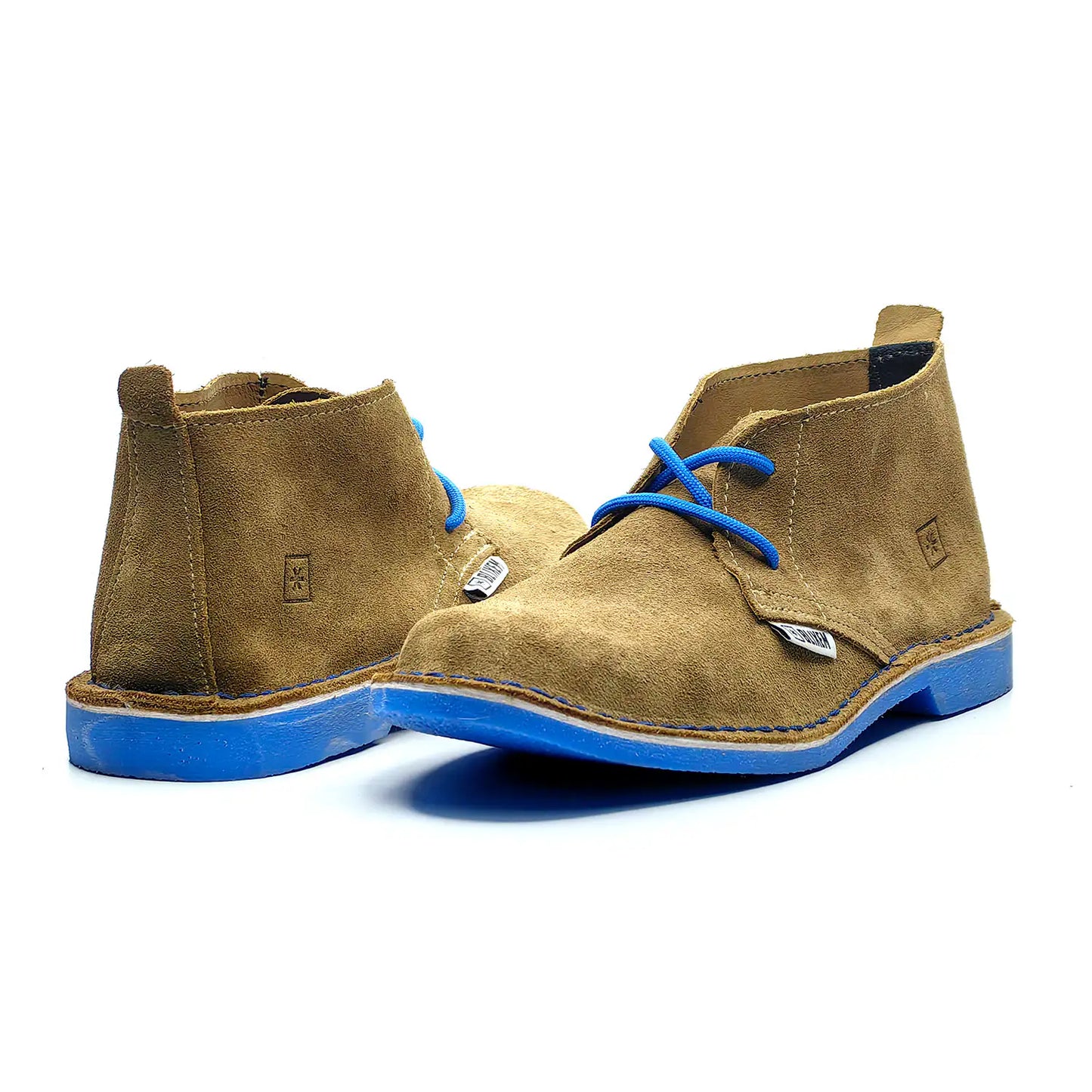 Pair of brown suede boots with blue soles on a white background