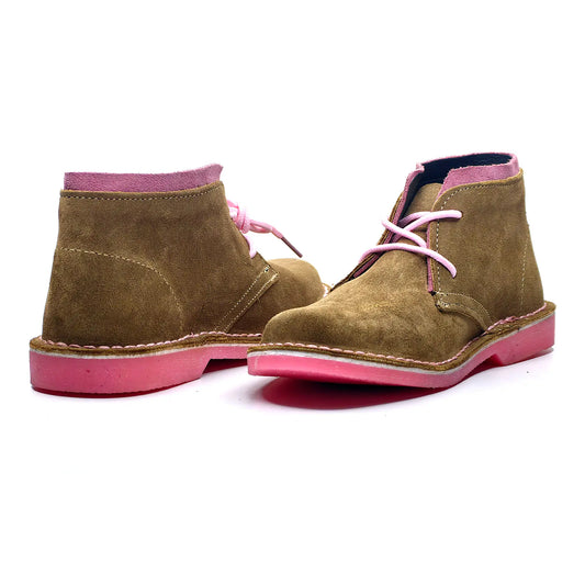 Brown suede boots with pink soles and laces on a white background
