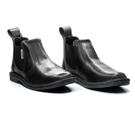 Pair of black leather Chelsea boots on a white background