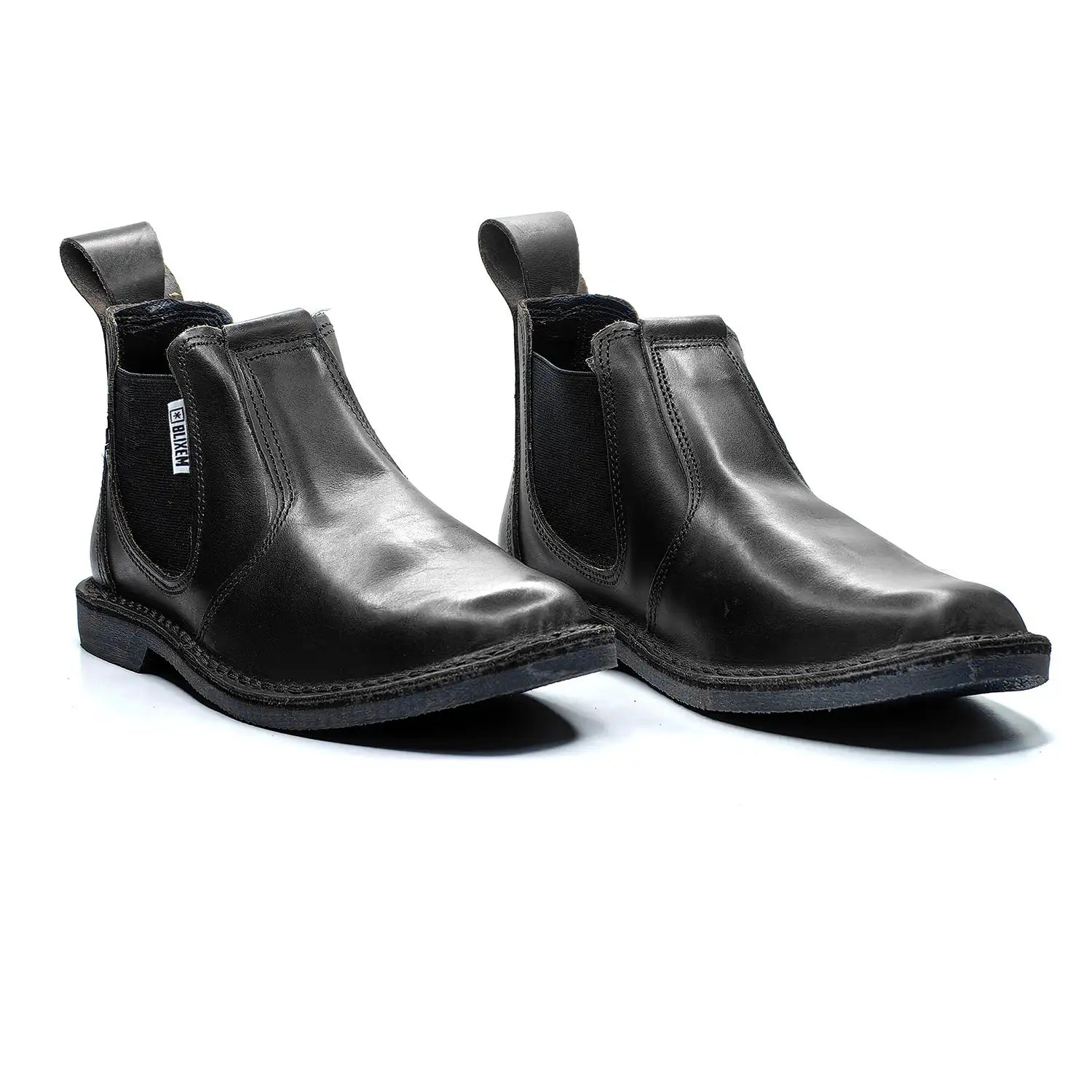 Pair of black leather Chelsea boots on a white background