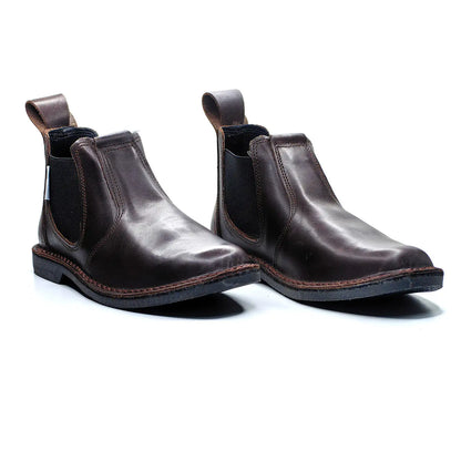 Pair of brown leather Chelsea boots on a white background
