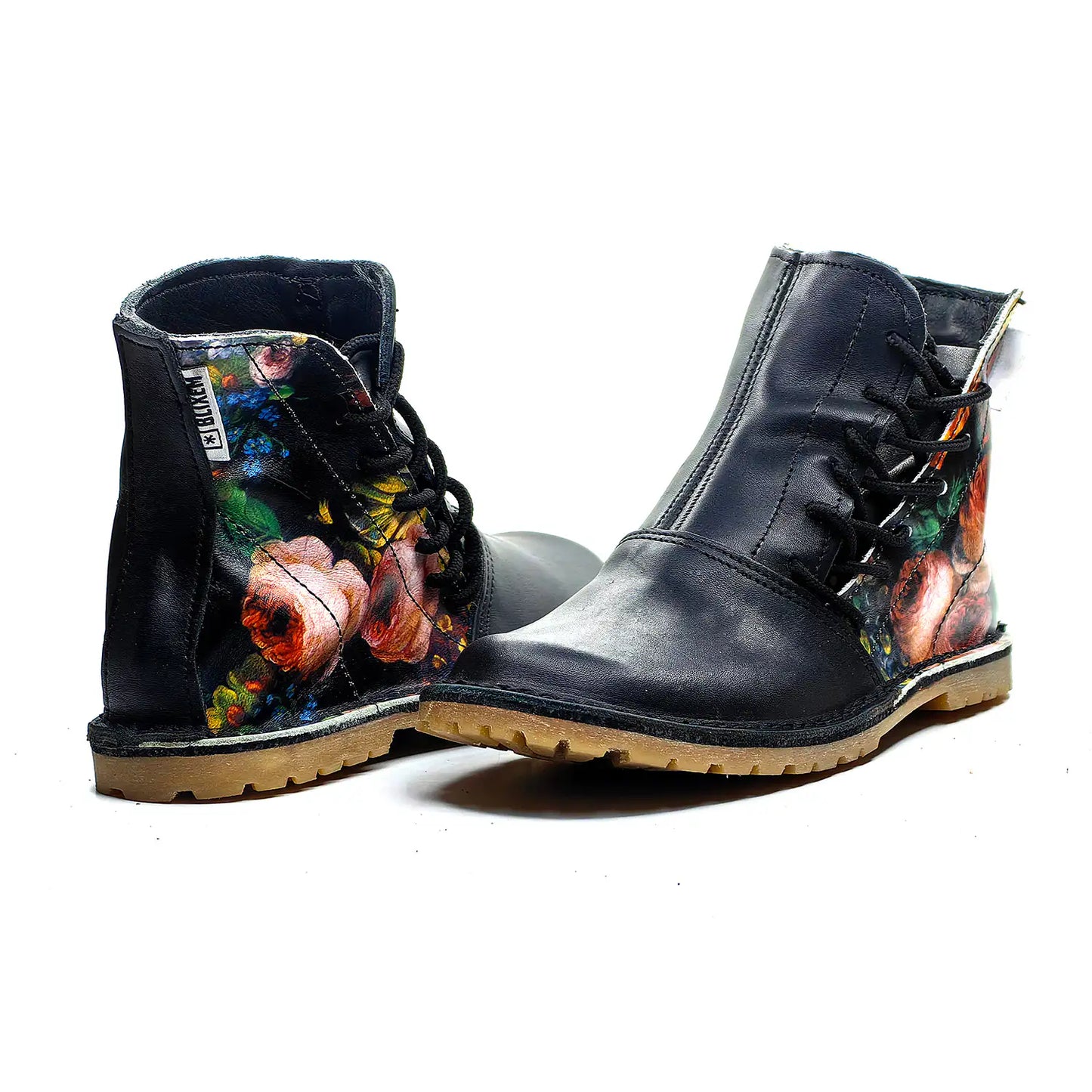 Pair of black boots with floral design on a white background