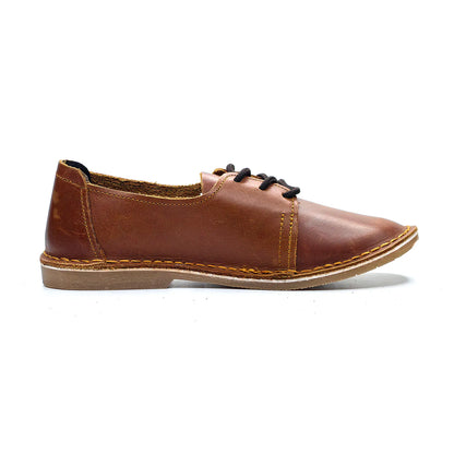 Brown leather shoe with black laces on a white background
