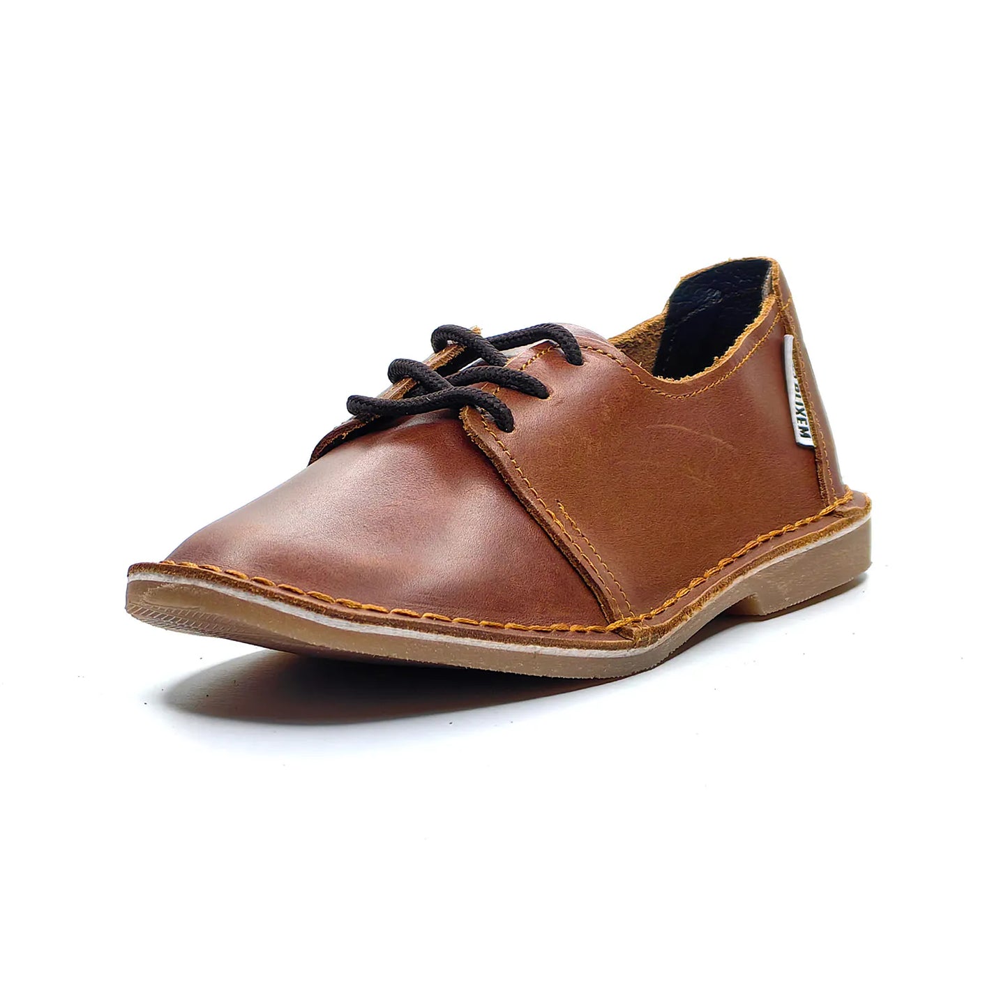 Brown leather shoe with black laces on a white background