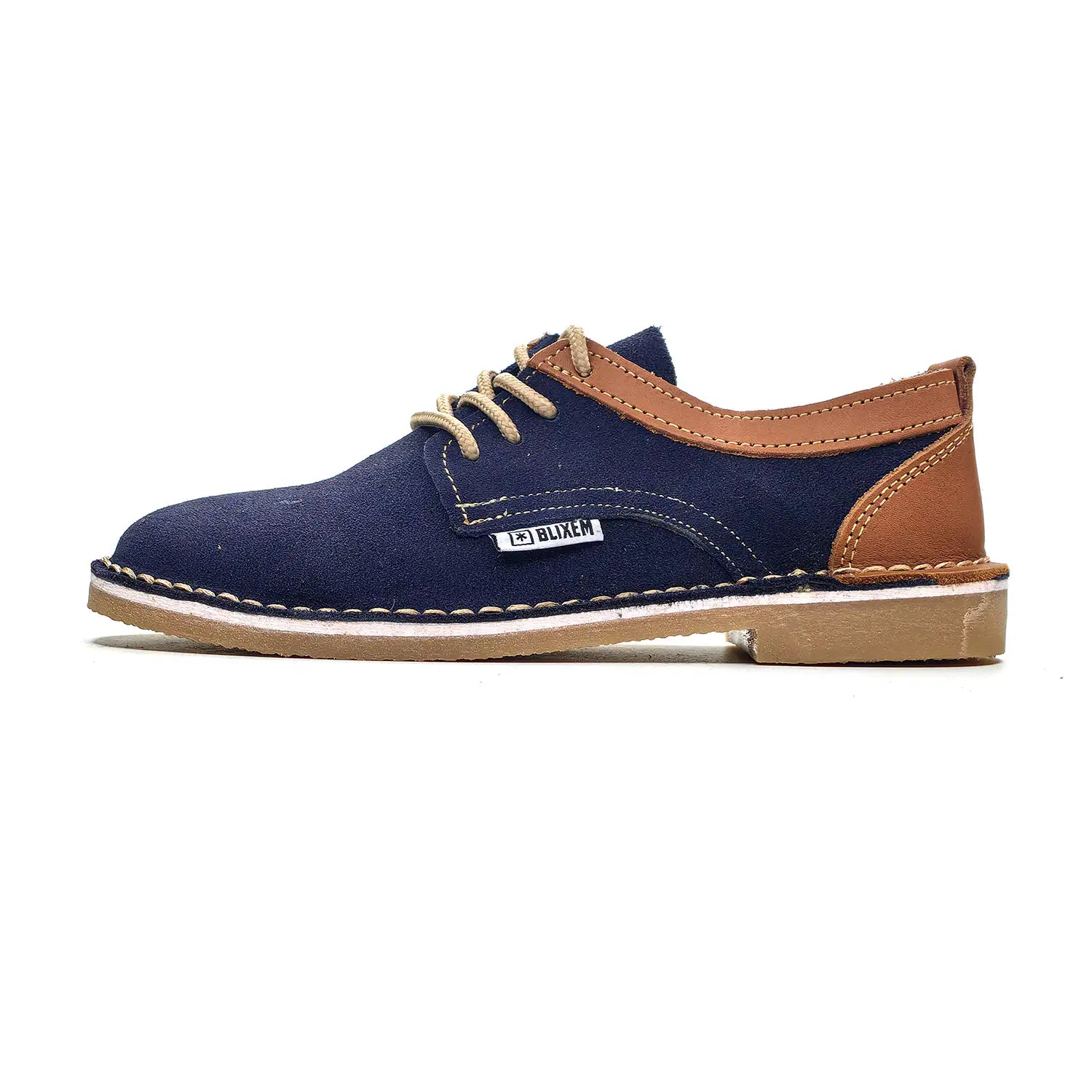 Navy blue shoe with brown accents on a white background
