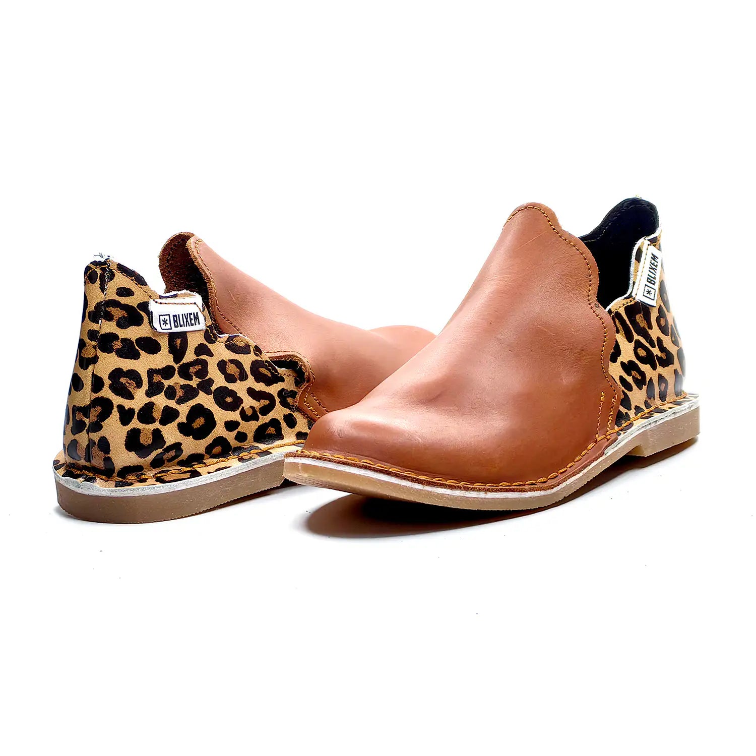 Brown ankle boots with leopard print accents on a white background