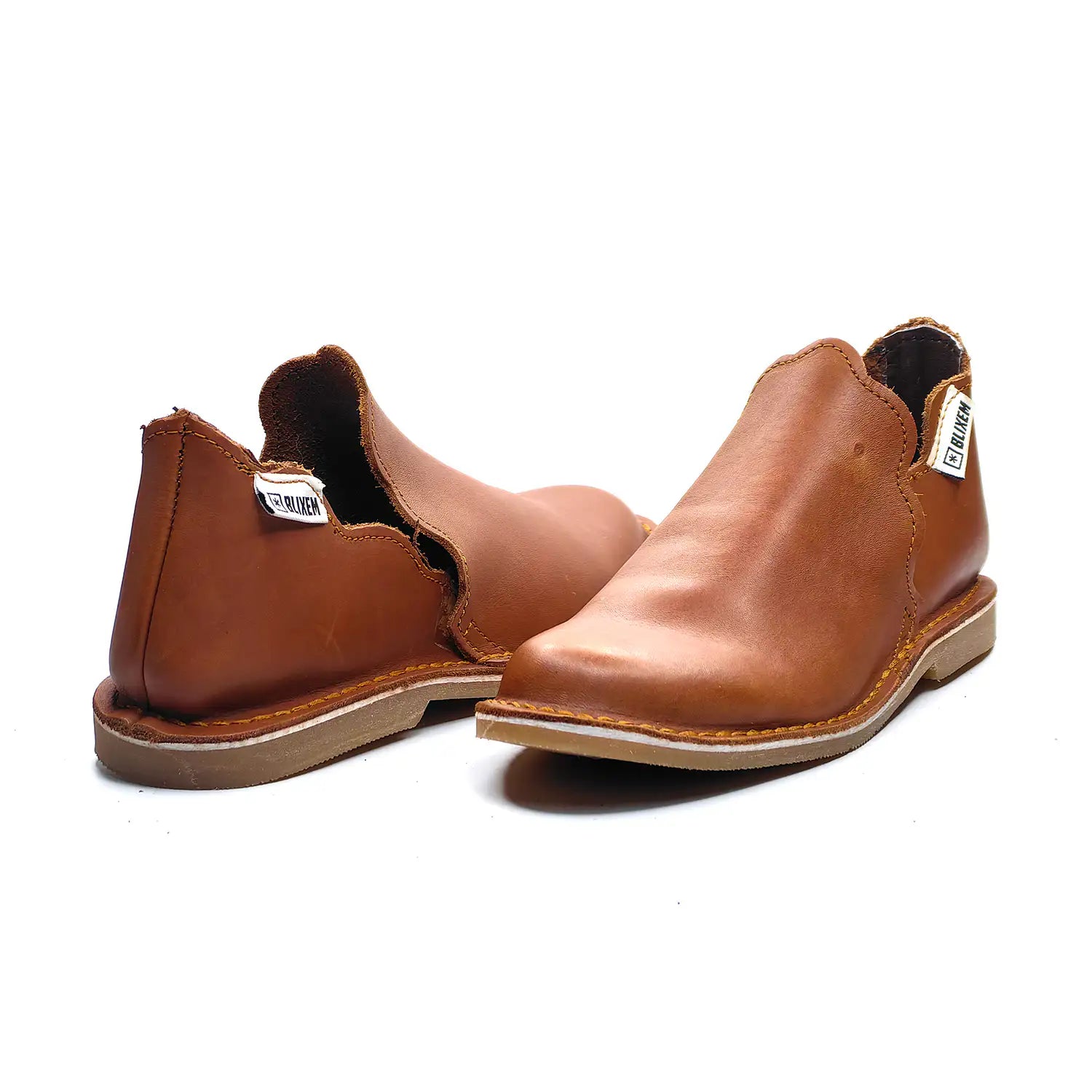 Pair of brown leather shoes on a white background