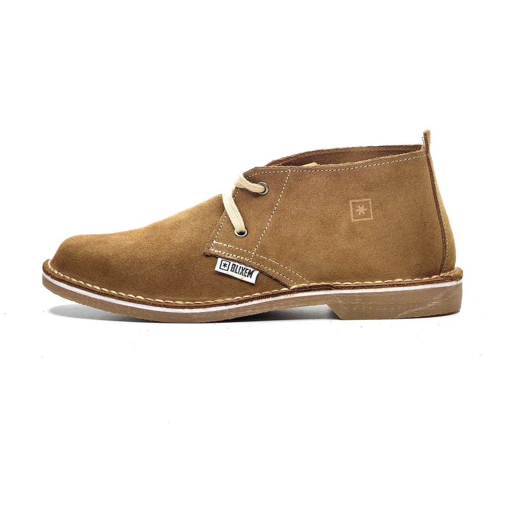 Brown suede shoe with a brand label on a white background