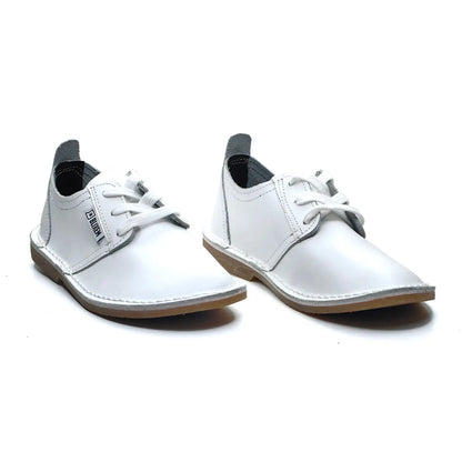 Pair of white ladies shoes on a white background